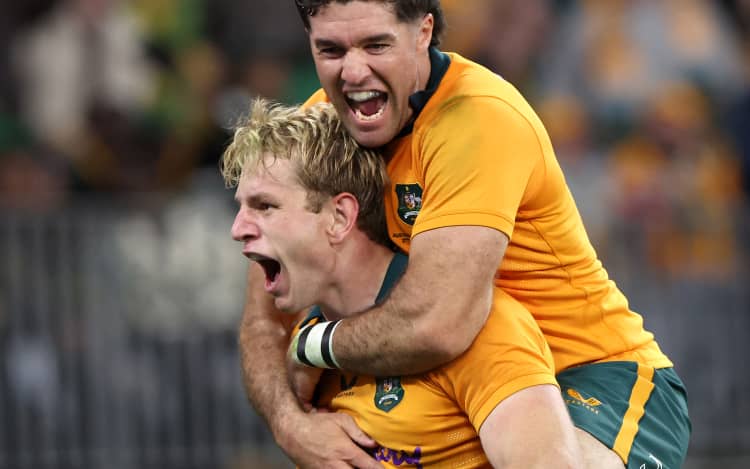 Australia's Max Jorgensen celebrates his try with teammate Ben Donaldson.