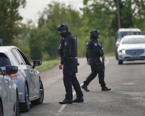 Police stopping and speaking to motorists on a country road