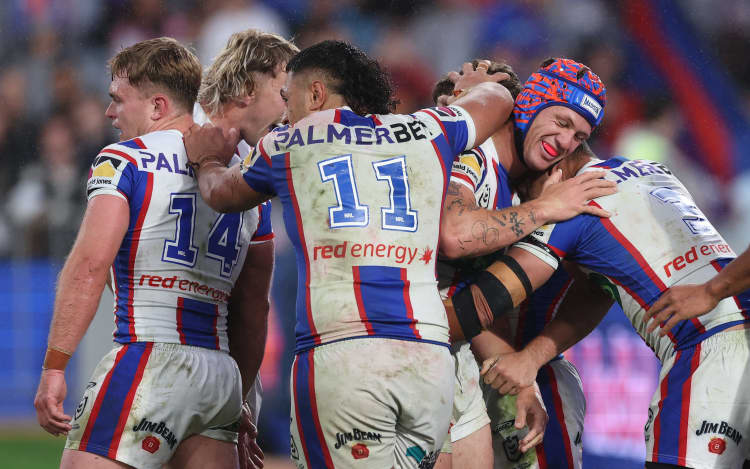 Sandon Smith (obscured) of the Knights celebrates scoring a try with teammates during the NRL Preliminary Final match between the Penrith Panthers and Newcastle Knights at Accor Stadium on September 27, 2026, in Sydney, Australia. (Photo by Darrian Traynor/Getty Images)