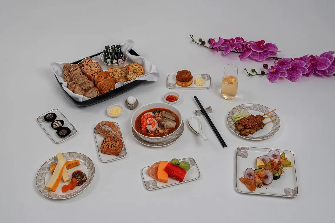 Some of the new dishes for business-class passengers are the fusion harmony rojak, Singapore-style prawn noodle soup and caramelised apple tart with vanilla mascarpone chantilly dessert.