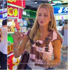 Ana Paula Siebert come espetinho de escorpião ao lado de Roberto Justus na China Foto: Reprodução/Instagram