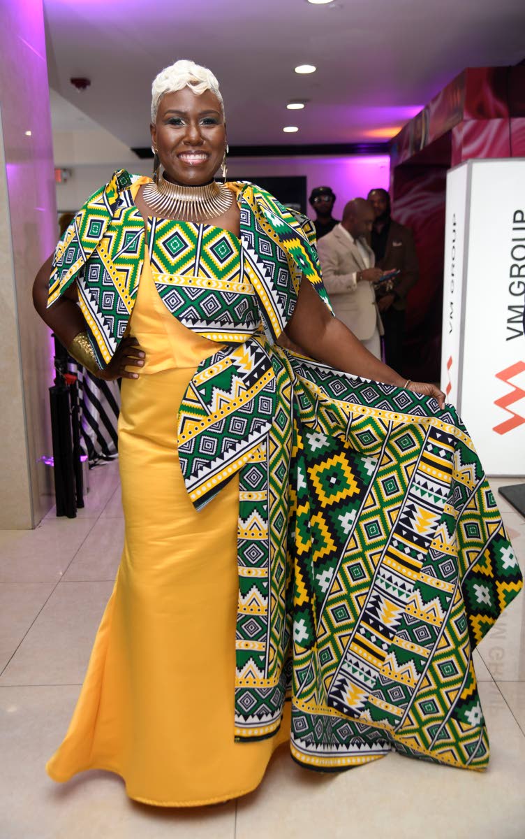 Kadeen Harvey, CEO of Fruit Blossoms, embraces bold colour in a striking custom Lucien Harrison creation featuring vibrant African patterns.