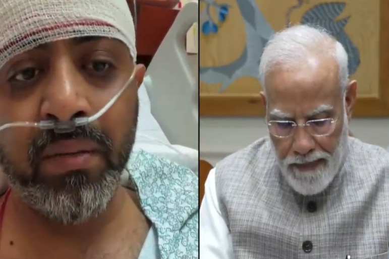 two men, one with head bandaged