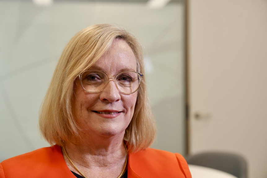 woman looks at camera