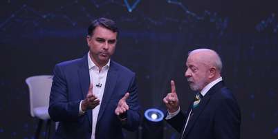 Lula e Flávio Bolsonaro durante debate Band/Estadão Foto: Werther Santana/Estadão / Estadão